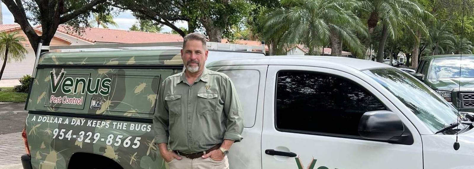 Lawrence Arnold, owner of Venus Pest Control, with a service truck