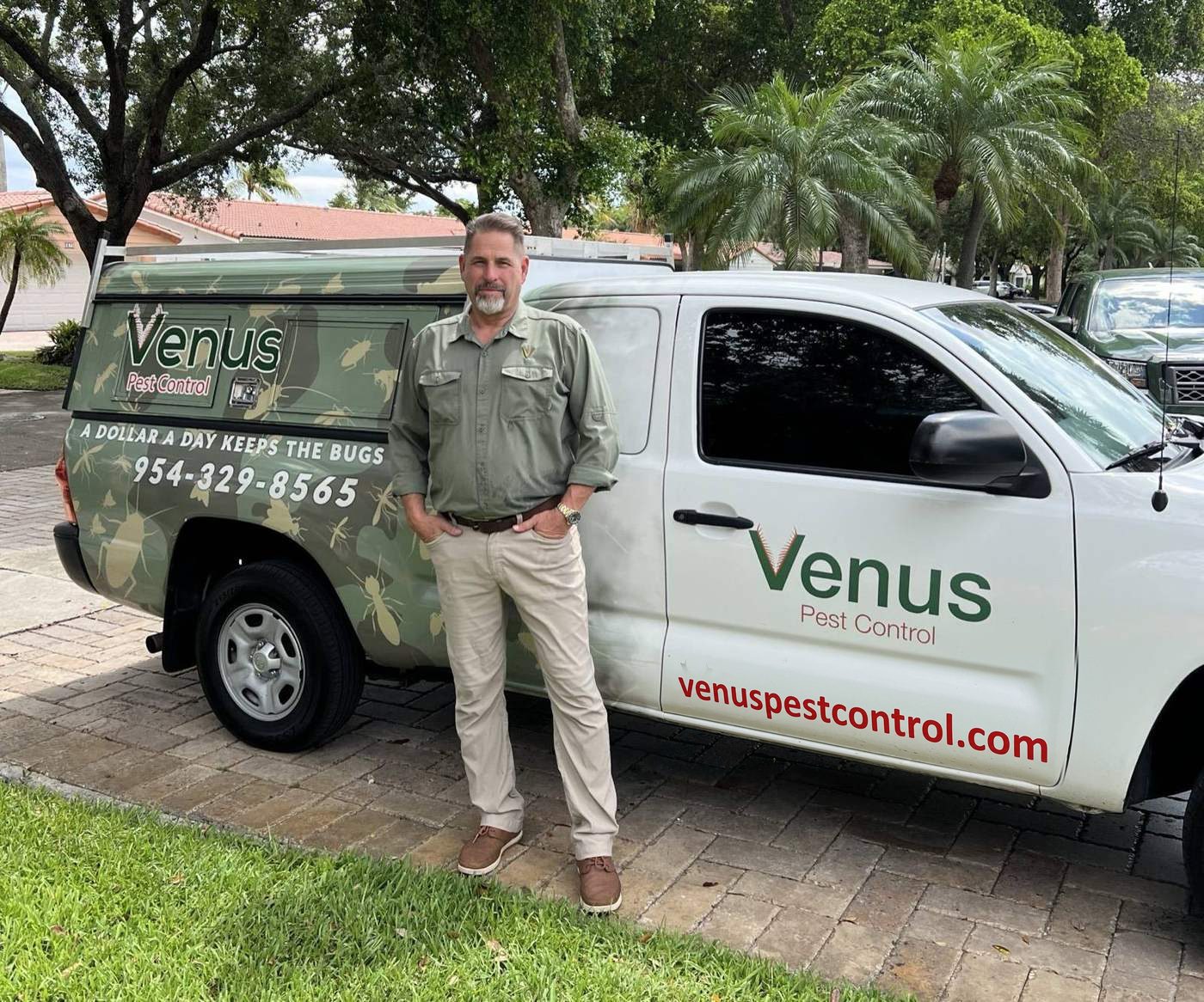 Lawrence Arnold, owner of Venus Pest Control, with his service truck in Miami Lakes, Florida