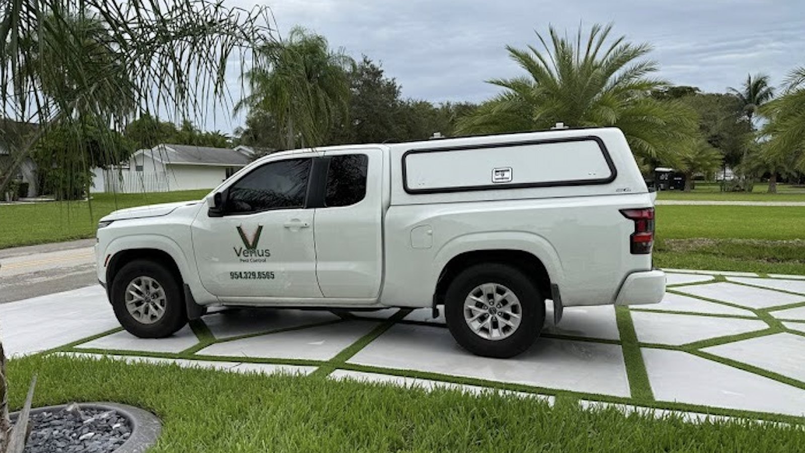 The Venus Pest Control service truck at a South Florida property